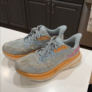 HOKA Women's Light Blue Running Sneakers with Orange Accents AS IS